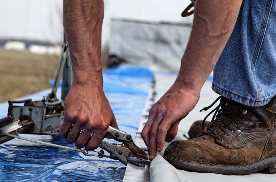 Ideal Roofing and Construction commercial roof seams, roofer putting in flat roof