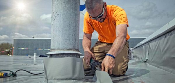 Guy working on roof.