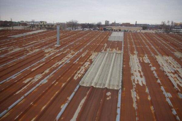 Rusty metal roof, full commercial roof replacement